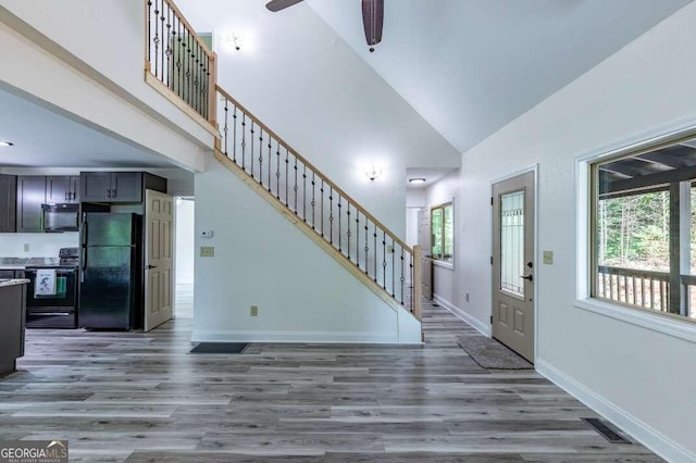 235 Red Bud Ln Unit 5, Hiawassee, GA 30546 - entryway with high vaulted ceiling, wood finished floors, stairs, a ceiling fan, and baseboards