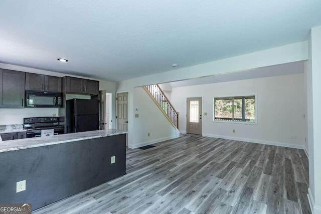 235 Red Bud Ln Unit 5, Hiawassee, GA 30546 - kitchen with black appliances, light wood-style floors, open floor plan, baseboards, and light stone countertops