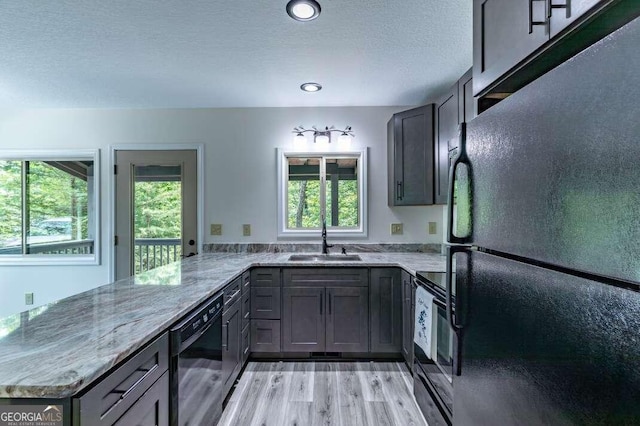 235 Red Bud Ln Unit 5, Hiawassee, GA 30546 - kitchen featuring black appliances, a sink, a peninsula, gray cabinets, and light stone counters