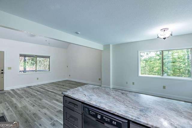 235 Red Bud Ln Unit 5, Hiawassee, GA 30546 - unfurnished living room featuring light wood-style floors, baseboards, and a textured ceiling