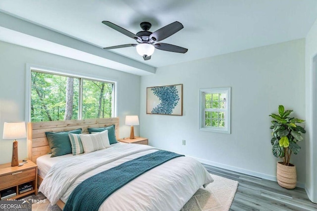 235 Red Bud Ln Unit 5, Hiawassee, GA 30546 - bedroom with multiple windows, baseboards, wood finished floors, and ceiling fan