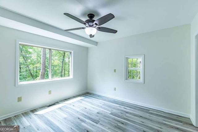 235 Red Bud Ln Unit 5, Hiawassee, GA 30546 - empty room with healthy amount of natural light, light wood finished floors, a ceiling fan, and baseboards