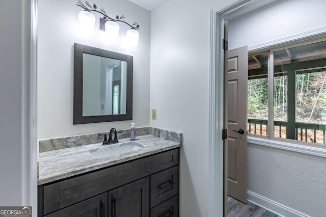 235 Red Bud Ln Unit 5, Hiawassee, GA 30546 - bathroom featuring vanity, wood finished floors, and baseboards