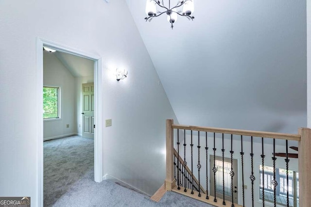 235 Red Bud Ln Unit 5, Hiawassee, GA 30546 - stairway featuring carpet, vaulted ceiling, a chandelier, and baseboards