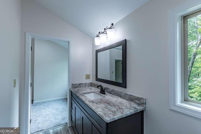 235 Red Bud Ln Unit 5, Hiawassee, GA 30546 - bathroom featuring vanity, wood finished floors, vaulted ceiling, and baseboards