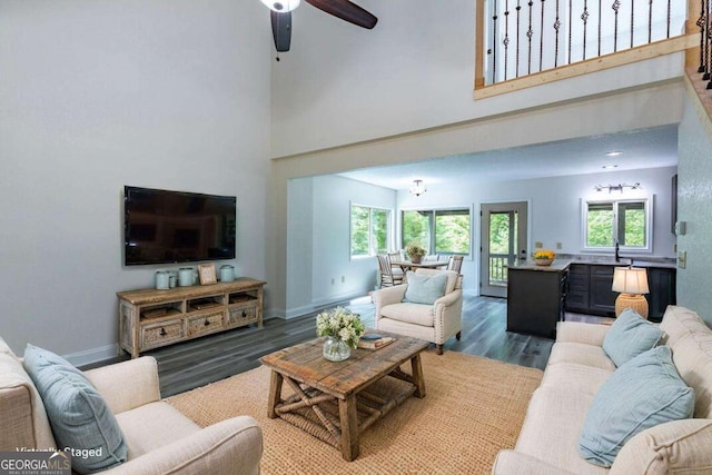 235 Red Bud Ln Unit 5, Hiawassee, GA 30546 - living area with a towering ceiling, wood finished floors, baseboards, and a ceiling fan