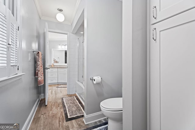 4030 River Ridge Chase Se, Marietta, GA 30067 - full bathroom featuring vanity, crown molding, toilet, baseboards, and wood finished floors