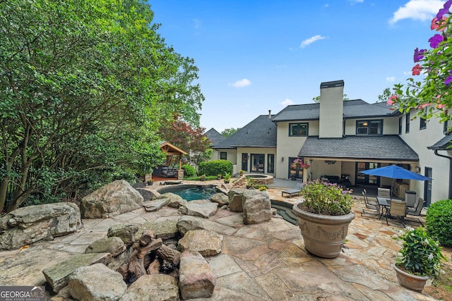 4030 River Ridge Chase Se, Marietta, GA 30067 - view of patio featuring an outdoor pool and a jacuzzi
