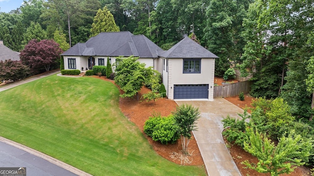 4030 River Ridge Chase Se, Marietta, GA 30067 - view of front facade with concrete driveway, a garage, a shingled roof, and stucco siding
