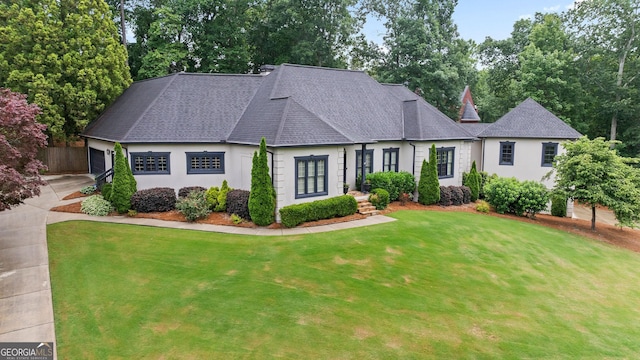 4030 River Ridge Chase Se, Marietta, GA 30067 - view of front of house featuring roof with shingles, a front yard, an attached garage, and stucco siding