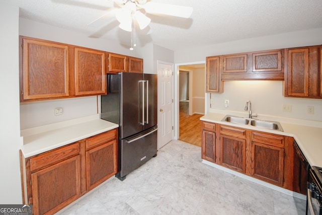 3697 E Bay St, Duluth, GA 30096 - kitchen with high quality fridge, a sink, a ceiling fan, and brown cabinetry