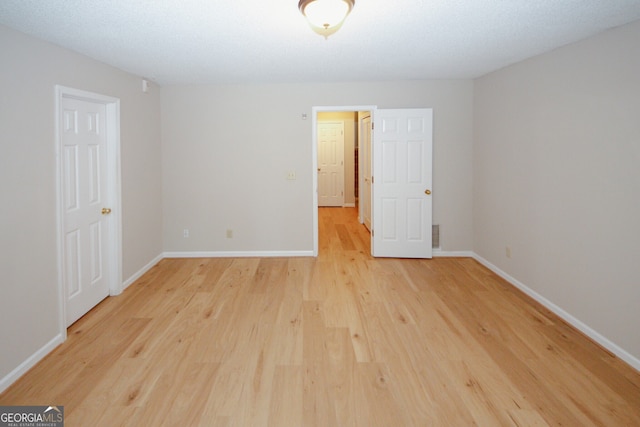 3697 E Bay St, Duluth, GA 30096 - spare room featuring light wood finished floors and baseboards