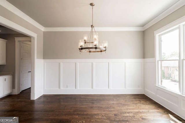 4821 Deer Creek Ct, Flowery Branch, GA 30542 - unfurnished dining area featuring a decorative wall, a chandelier, a wainscoted wall, dark wood-style flooring, and crown molding