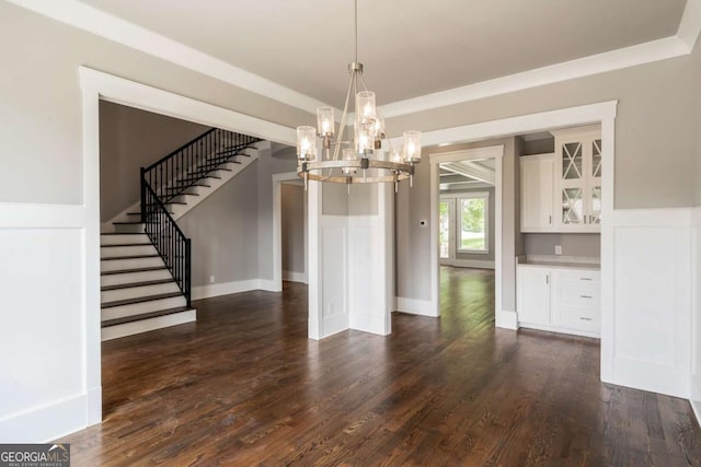 4821 Deer Creek Ct, Flowery Branch, GA 30542 - unfurnished dining area featuring stairway, a chandelier, dark wood-style floors, and a wainscoted wall