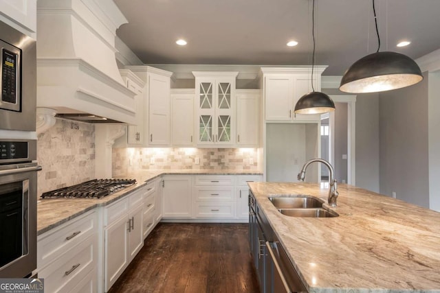 4821 Deer Creek Ct, Flowery Branch, GA 30542 - kitchen featuring stainless steel appliances, white cabinets, custom exhaust hood, light stone countertops, and recessed lighting