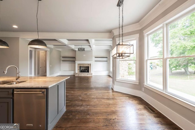 4821 Deer Creek Ct, Flowery Branch, GA 30542 - kitchen with plenty of natural light, stainless steel dishwasher, a fireplace, hanging light fixtures, and recessed lighting