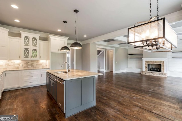 4821 Deer Creek Ct, Flowery Branch, GA 30542 - kitchen featuring open floor plan, recessed lighting, dishwasher, a chandelier, and light stone counters