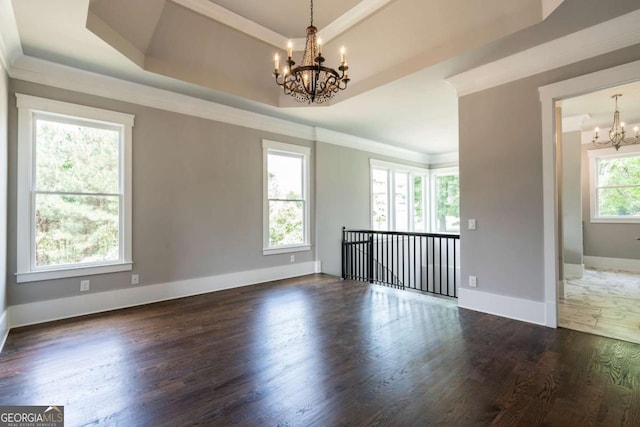 4821 Deer Creek Ct, Flowery Branch, GA 30542 - unfurnished room featuring a chandelier, wood finished floors, a tray ceiling, and crown molding