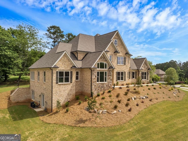 4821 Deer Creek Ct, Flowery Branch, GA 30542 - view of front facade with a front yard, a shingled roof, and brick siding