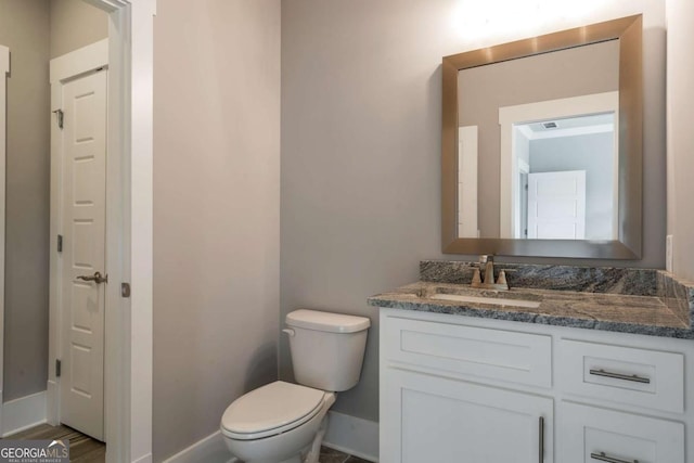 4821 Deer Creek Ct, Flowery Branch, GA 30542 - bathroom featuring vanity and toilet