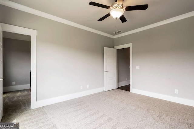 4821 Deer Creek Ct, Flowery Branch, GA 30542 - spare room with carpet floors, a ceiling fan, and ornamental molding