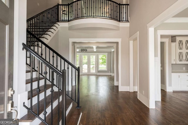 4821 Deer Creek Ct, Flowery Branch, GA 30542 - entryway with wood finished floors, stairway, a towering ceiling, and french doors
