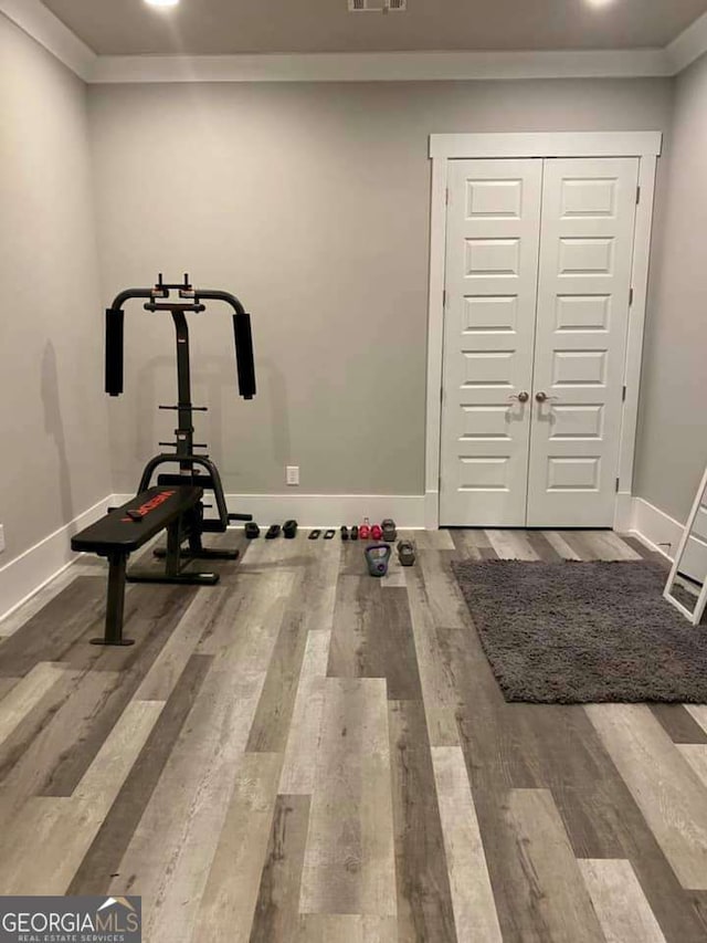 4821 Deer Creek Ct, Flowery Branch, GA 30542 - workout room featuring ornamental molding, wood finished floors, and recessed lighting
