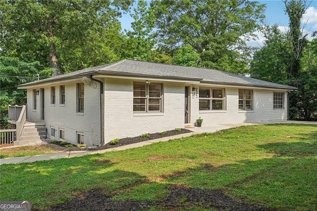 3422 Maplehurst Dr, Decatur, GA 30032 - ranch-style house with brick siding, a front yard, and view of wooded area