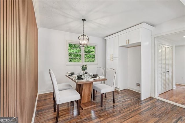 3422 Maplehurst Dr, Decatur, GA 30032 - dining space with a chandelier, dark wood-type flooring, and baseboards