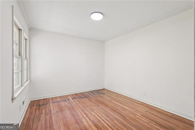 3422 Maplehurst Dr, Decatur, GA 30032 - empty room featuring ornamental molding, plenty of natural light, wood finished floors, and baseboards