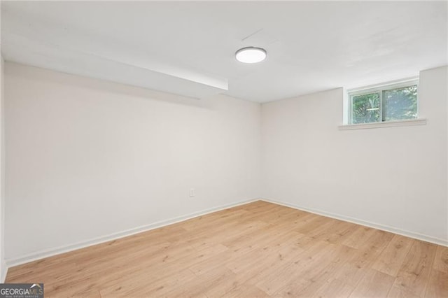 3422 Maplehurst Dr, Decatur, GA 30032 - basement with light wood finished floors and baseboards