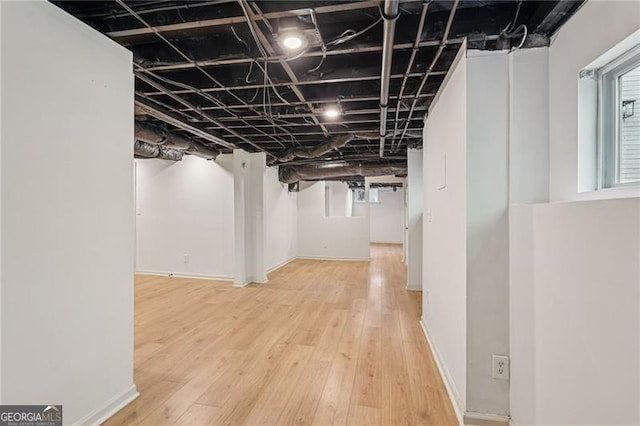 3422 Maplehurst Dr, Decatur, GA 30032 - below grade area featuring wood finished floors and baseboards