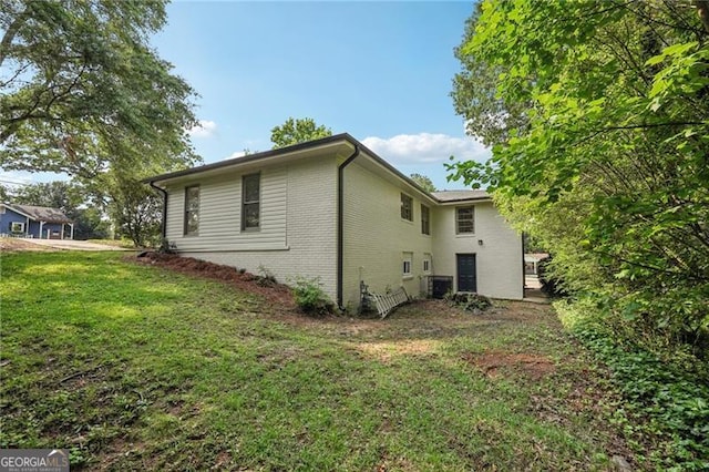 3422 Maplehurst Dr, Decatur, GA 30032 - view of side of property with brick siding and a lawn