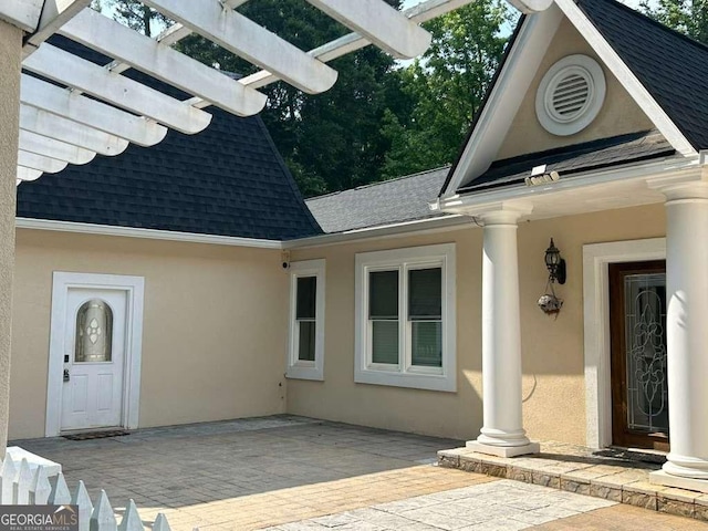 3309 Bethany Bnd, Alpharetta, GA 30004 - doorway to property with roof with shingles, stucco siding, and a pergola