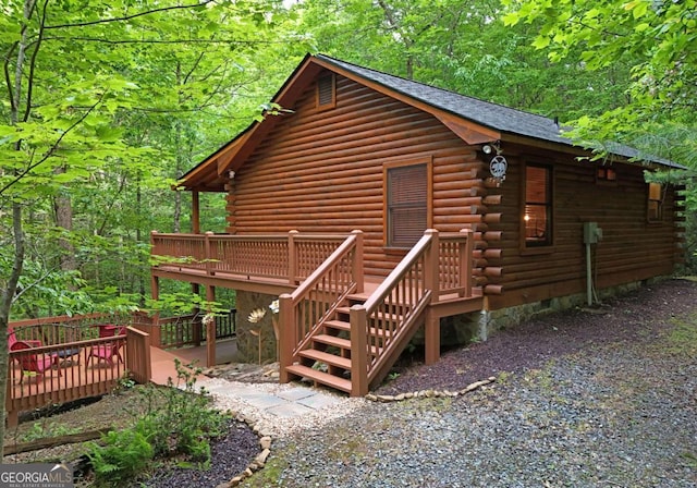 58 Hatchet Trl, Cherry Log, GA 30522 - view of property exterior featuring log exterior, a deck, and a view of trees
