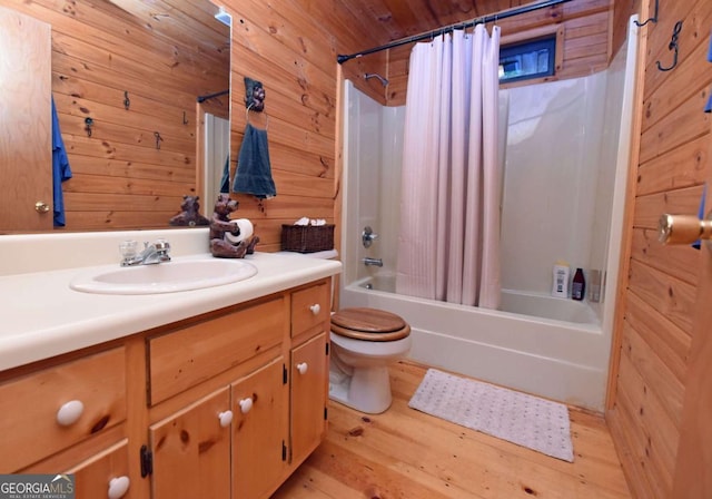 58 Hatchet Trl, Cherry Log, GA 30522 - bathroom featuring toilet, vanity, shower / tub combo, wood finished floors, and wooden walls
