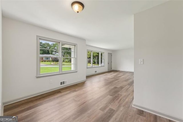1261 Cliffwood Dr SE, Smyrna, GA 30080 - spare room with wood finished floors and baseboards