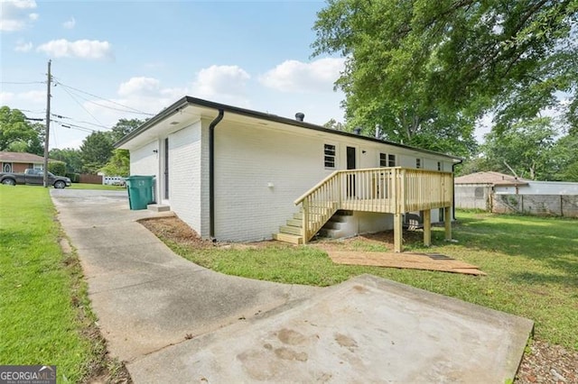 1261 Cliffwood Dr SE, Smyrna, GA 30080 - rear view of house featuring brick siding, a wooden deck, stairway, and a patio area