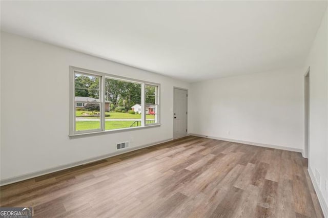 1261 Cliffwood Dr SE, Smyrna, GA 30080 - unfurnished room with wood finished floors and baseboards