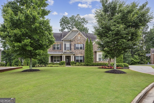 2579 Lulworth Ln, Marietta, GA 30062 - craftsman-style house with stone siding, a front lawn, and a standing seam roof