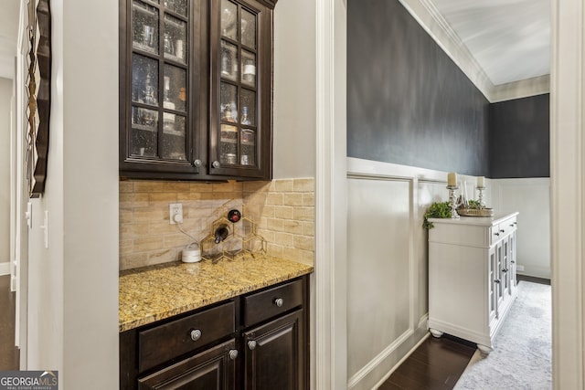 2579 Lulworth Ln, Marietta, GA 30062 - bar with wainscoting, decorative backsplash, dark wood finished floors, ornamental molding, and a decorative wall