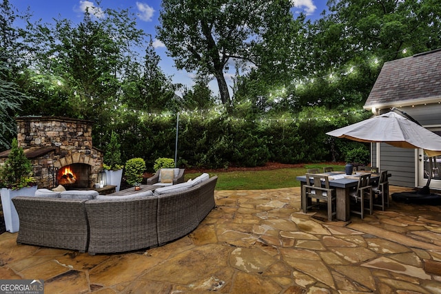 2579 Lulworth Ln, Marietta, GA 30062 - view of patio / terrace with an outdoor living space with a fireplace, outdoor dining space, and view of scattered trees