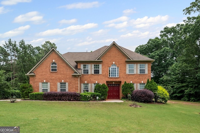 125 Ancient Oak Ln, Stockbridge, GA 30281 - view of front facade with brick siding and a front lawn