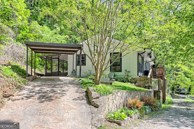 41 Mike Foster Ln, Clayton, GA 30525 - mid-century modern home featuring concrete driveway and a carport