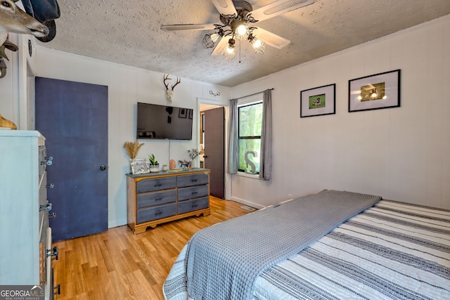41 Mike Foster Ln, Clayton, GA 30525 - bedroom featuring light wood finished floors, a textured ceiling, and a ceiling fan