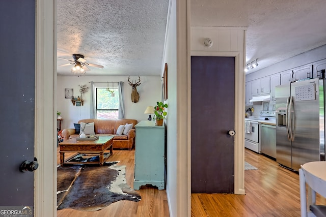 41 Mike Foster Ln, Clayton, GA 30525 - hallway with a textured ceiling and light wood-style flooring
