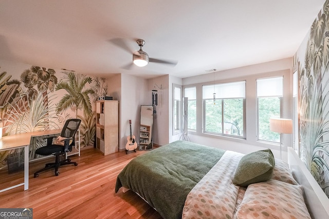 1267 Thomas Rd, Decatur, GA 30030 - bedroom with wood finished floors, ceiling fan, and an office area