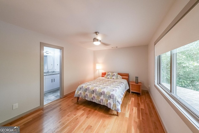 1267 Thomas Rd, Decatur, GA 30030 - bedroom with light wood-style flooring, a sink, and baseboards
