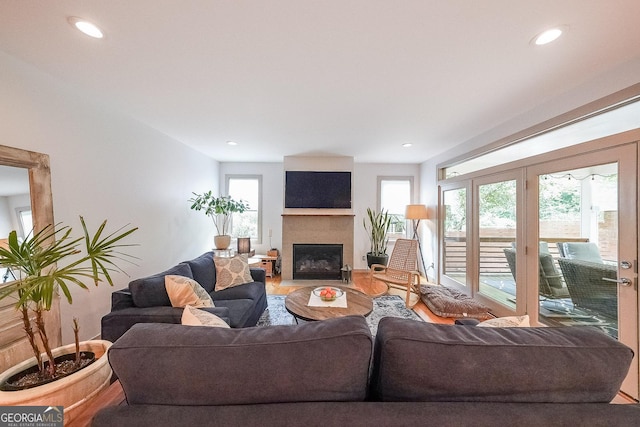1267 Thomas Rd, Decatur, GA 30030 - living area featuring a fireplace with flush hearth, recessed lighting, and wood finished floors