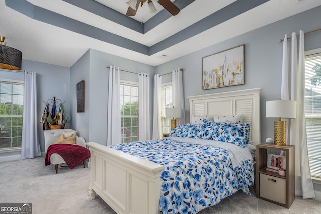 158 Sugarloaf Cir, Macon, GA 31204 - carpeted bedroom with multiple windows and ceiling fan